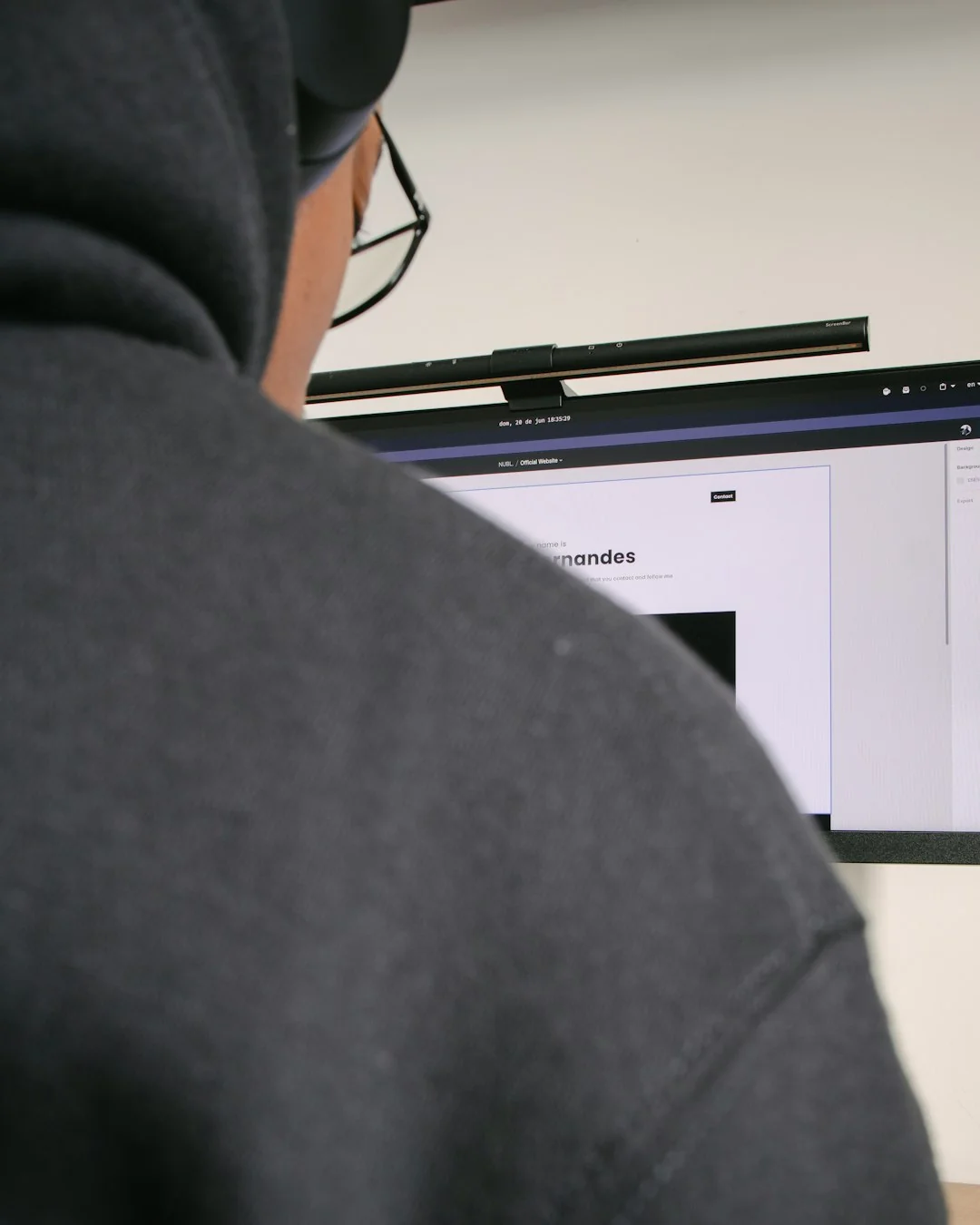 Person shopping online using a laptop and credit card, highlighting e-commerce convenience.
